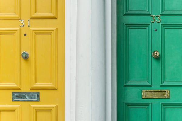 Two different coloured doors to highlight the differences between copywriting and content marketing