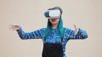 A women engaging with virtual reality headset