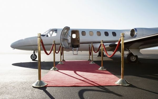 A private jet and red carpet to emphasise how words can make people feel special